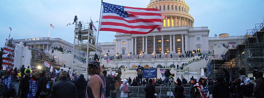 United_States_Capitol_outside_protesters_with_US_flag_20210106_1 (1)