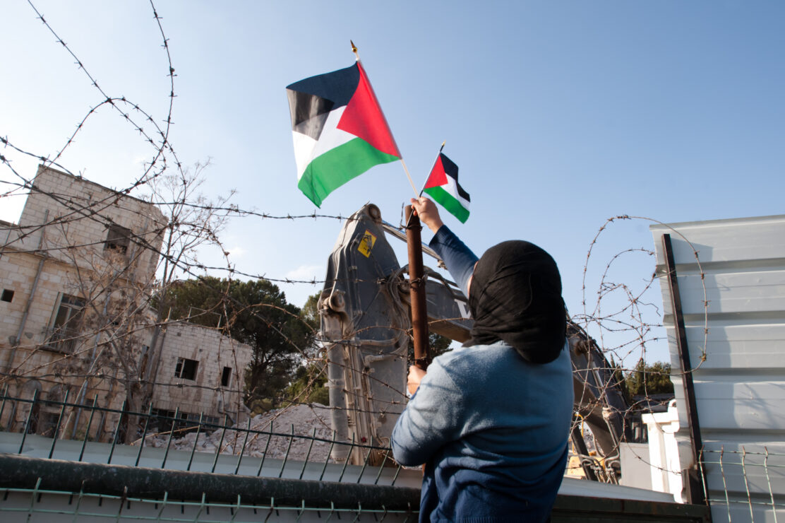 East,Jerusalem,-,January,14:,An,Arab,Woman,Puts,Palestinian