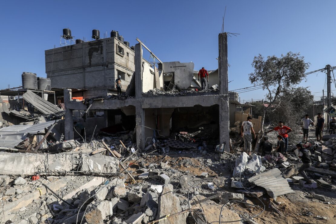 Palestinians,Search,Building,After,An,Israeli,Air,Strike,,In,The
